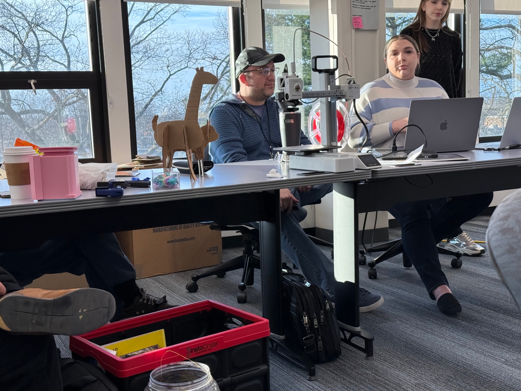 Kent State students presenting 3D-printed prototypes and cardboard animal models
