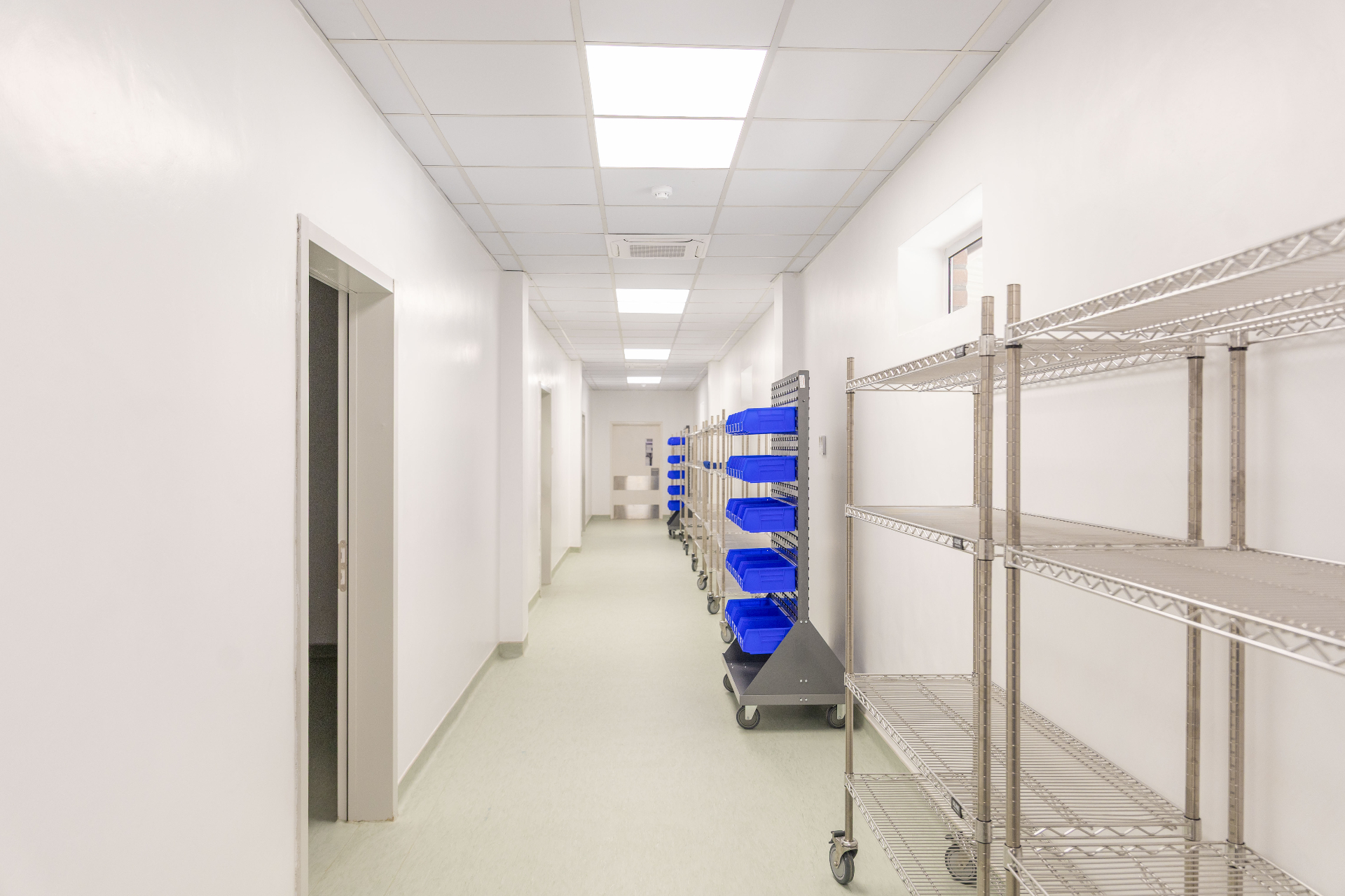 CURE Malawi corridor with supply carts leading to patient rooms